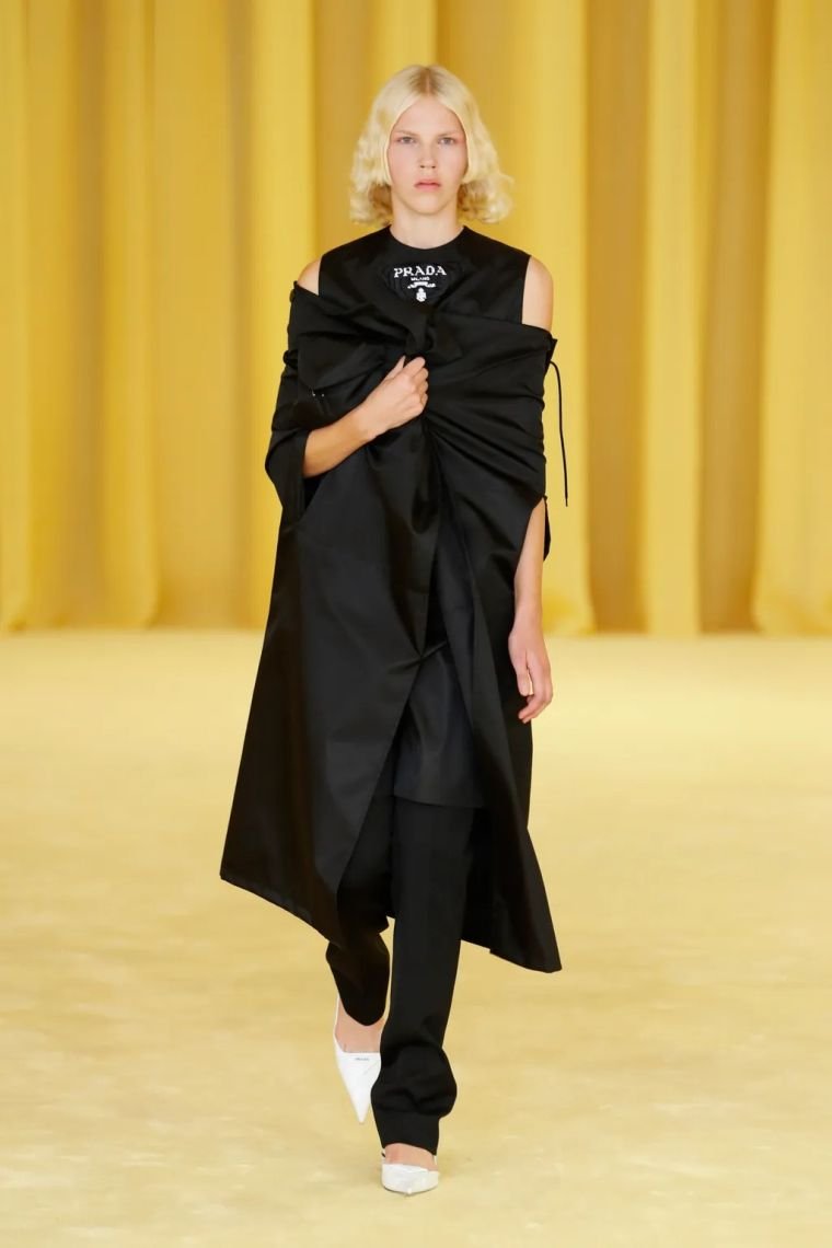 15. Classic cape in black by Prada