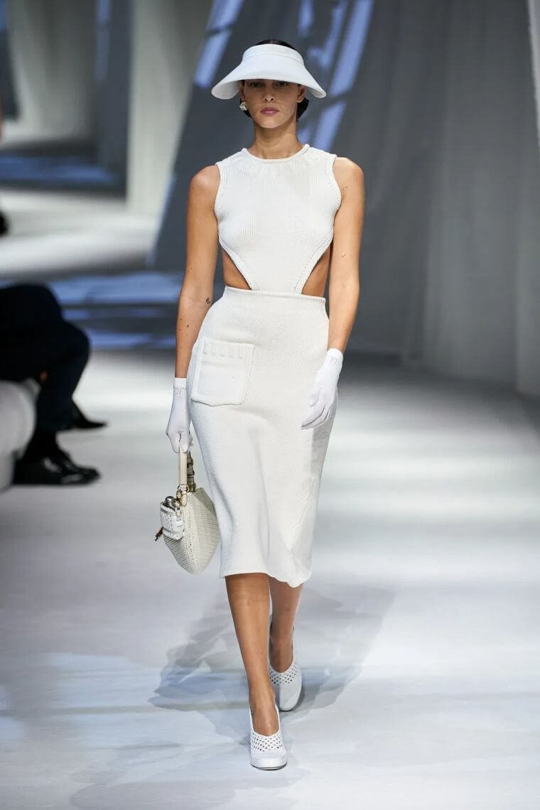 25. Elegant summer dress in white with cut out part