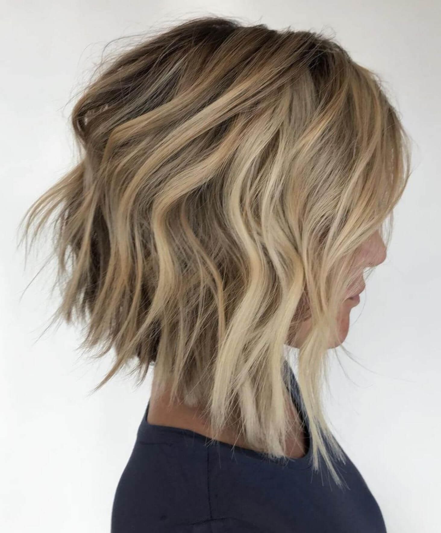 Daring choppy bob with unique elements like hair color, highlights, or shaved sides for a statement-making and unconventional look