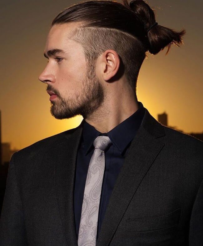 Hairstyle with longer hair on top and closely shaved sides, striking a balance between versatility and edginess